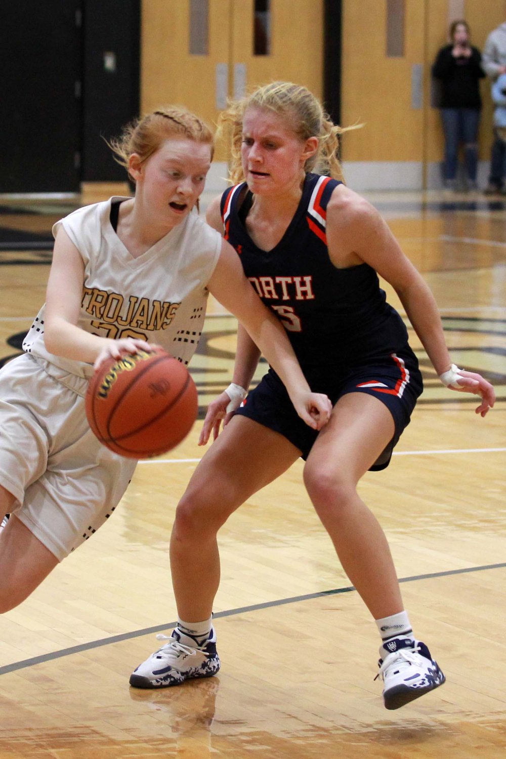 Madi Welch of North Montgomery moves to cut off a drive by Emma Holycross of Covington.